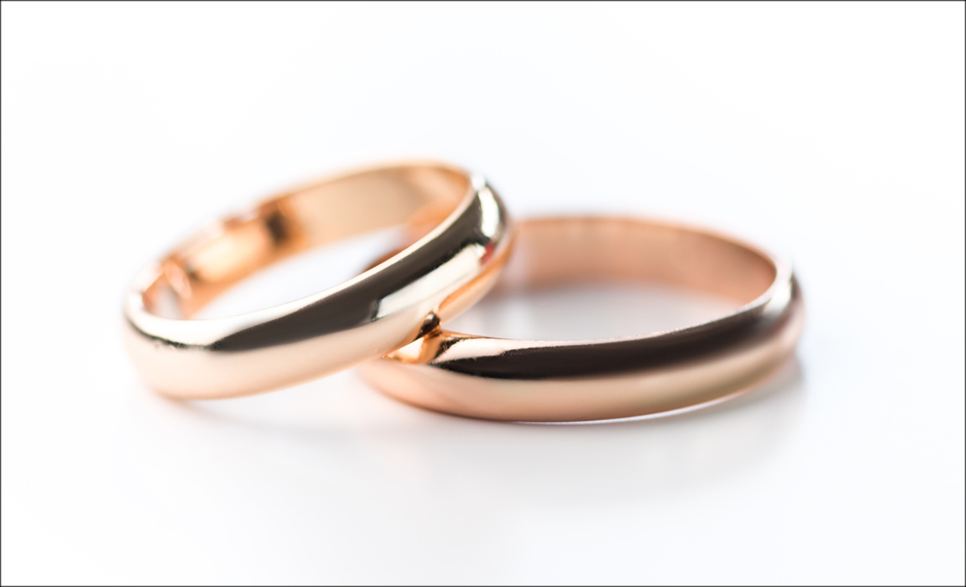 two wedding rings stacked on one another