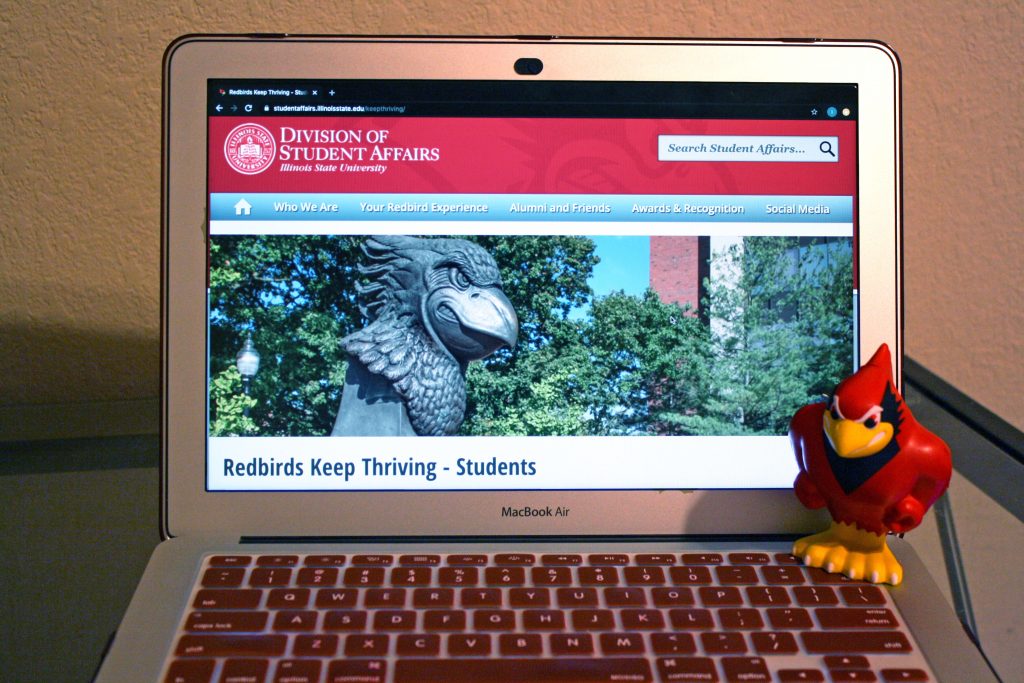 Laptop open to Redbirds Keep Thriving website.