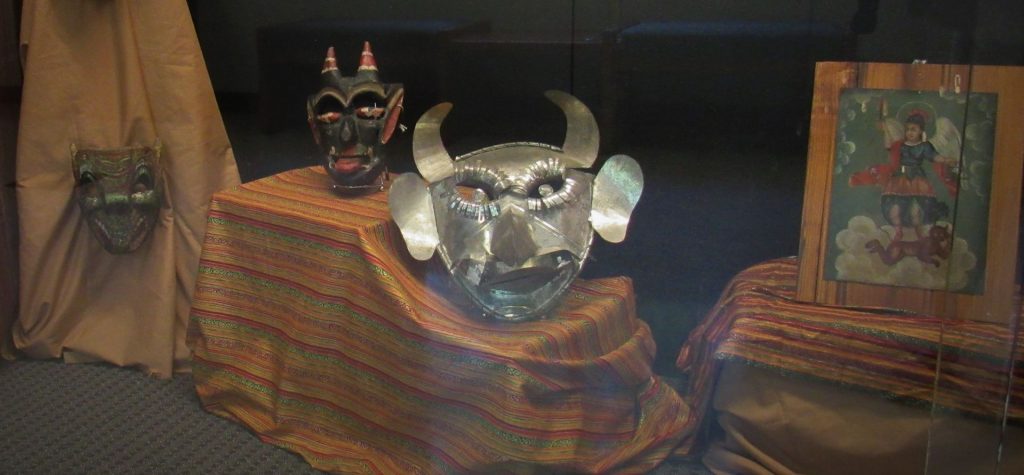 Traditional Mexican mask display of 3 masks