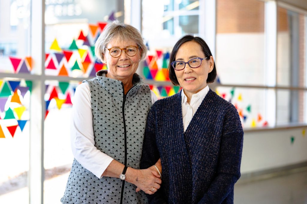 former professor and her former student pose at University Galleries