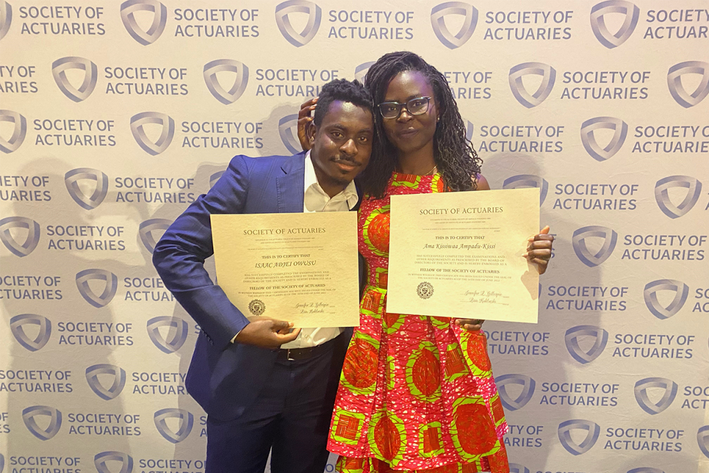 Isaac Owusu and Ama Ampadu-Kissi-Owusu pose with certificates at their Fellow of the Society of Actuaries ceremony.