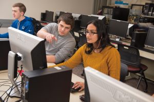 Students Evan Rappe, Nicholas Dangles and Karthika Venkatraman, from left, are learning about cybersecurity—one of the most in-demand jobs in the computing industry.